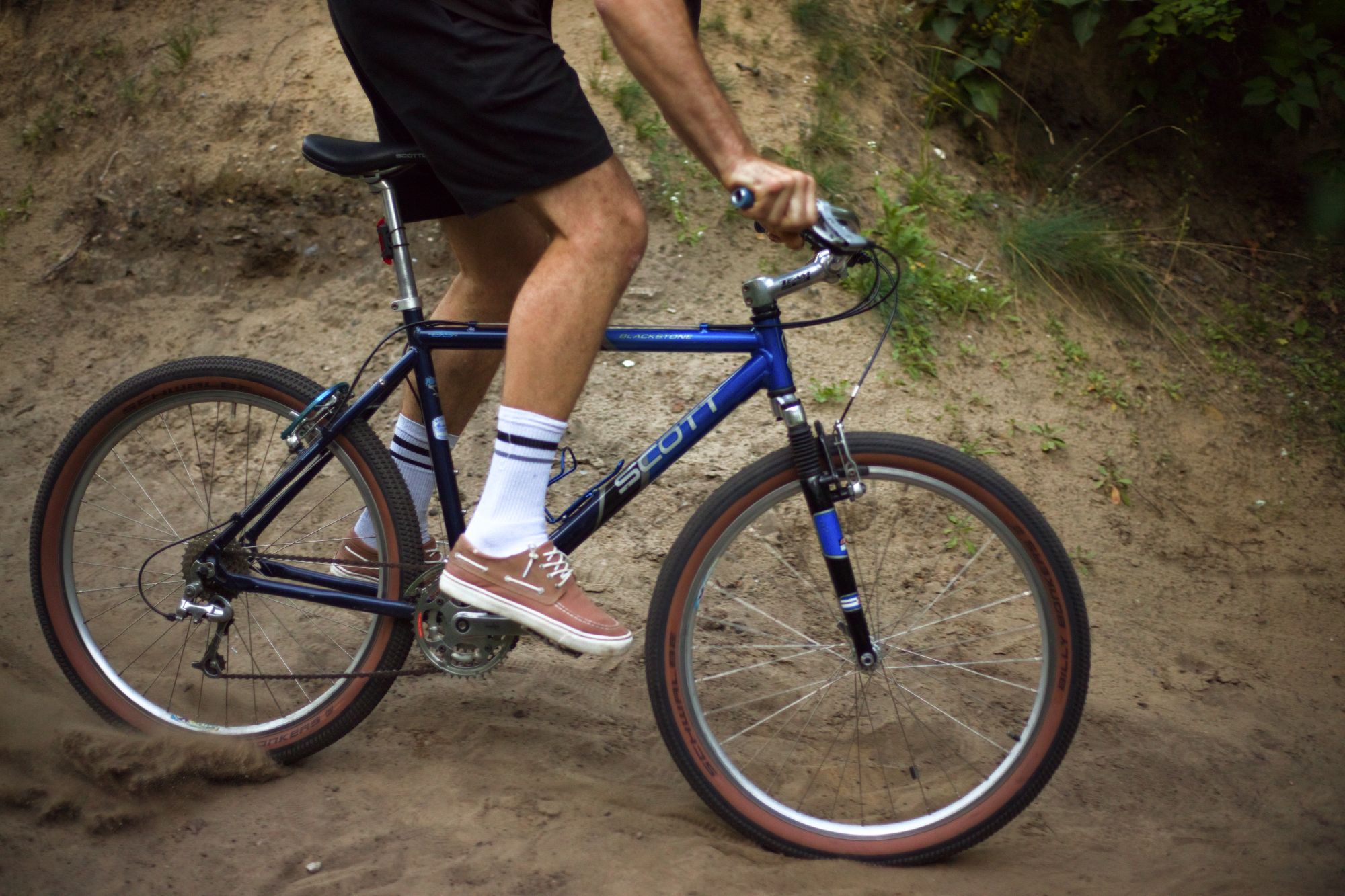 Blue Scott Blackstone mountain bike ridden through a sandy track