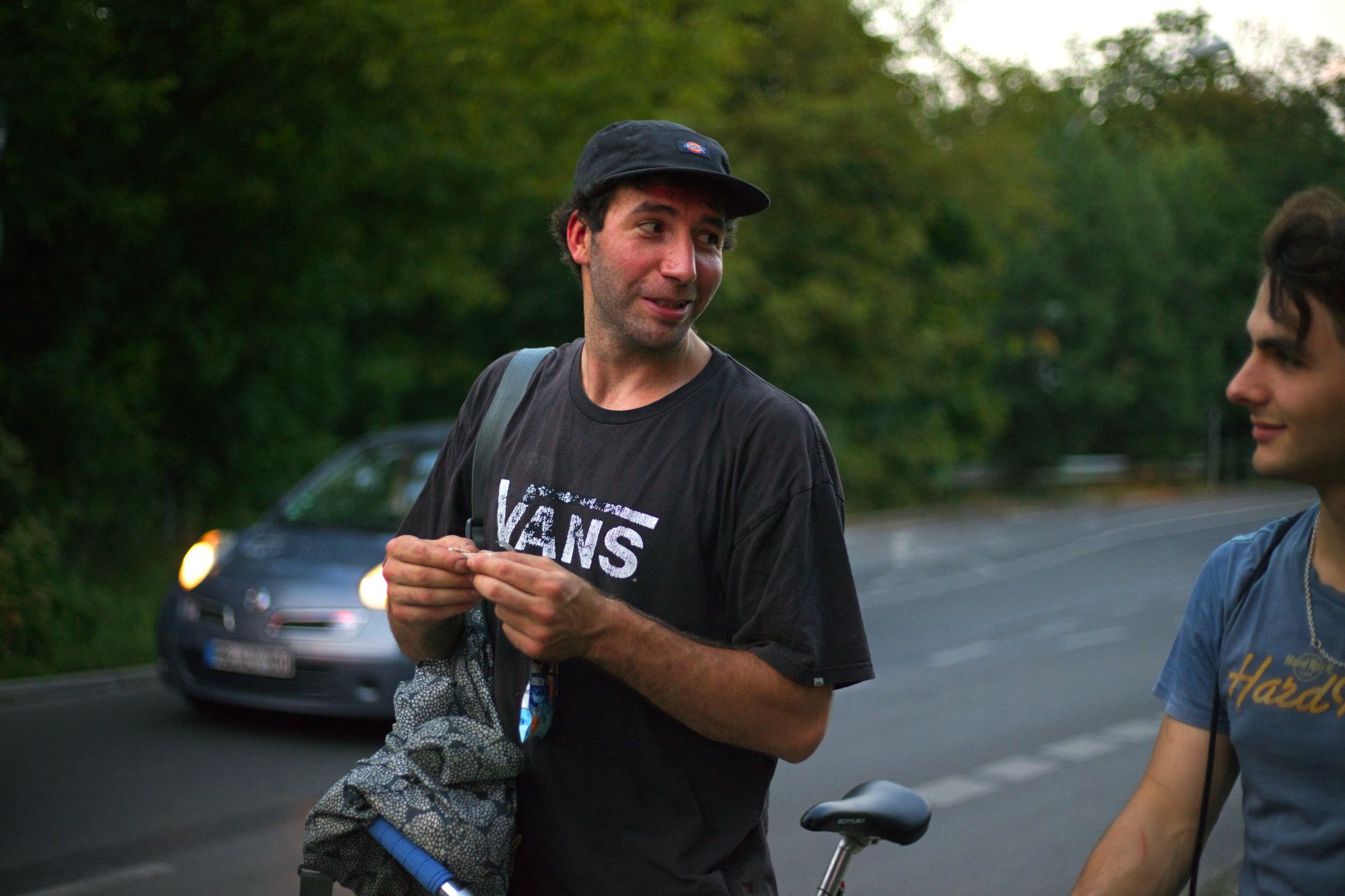 Two riders talking beside a Berlin street after the ride